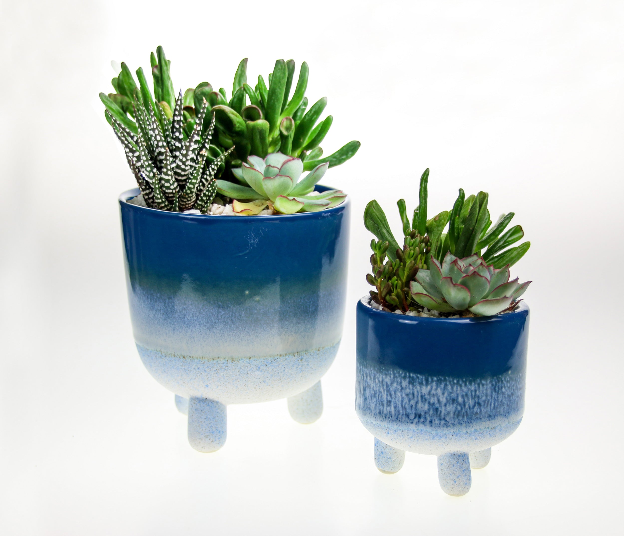 Blue stoneware indoor planters with legs
