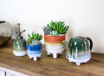 Indoor stoneware planters with matching water mister and watering can