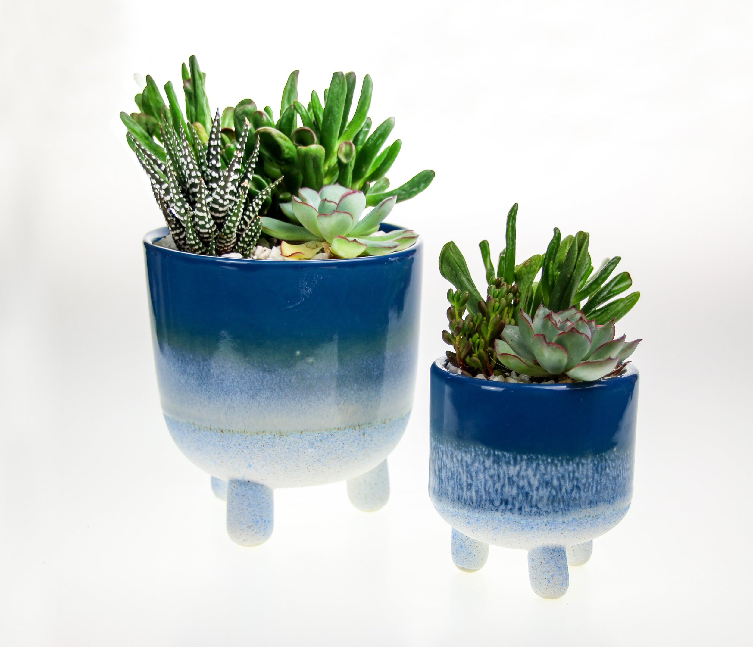 Blue stoneware indoor planters with legs